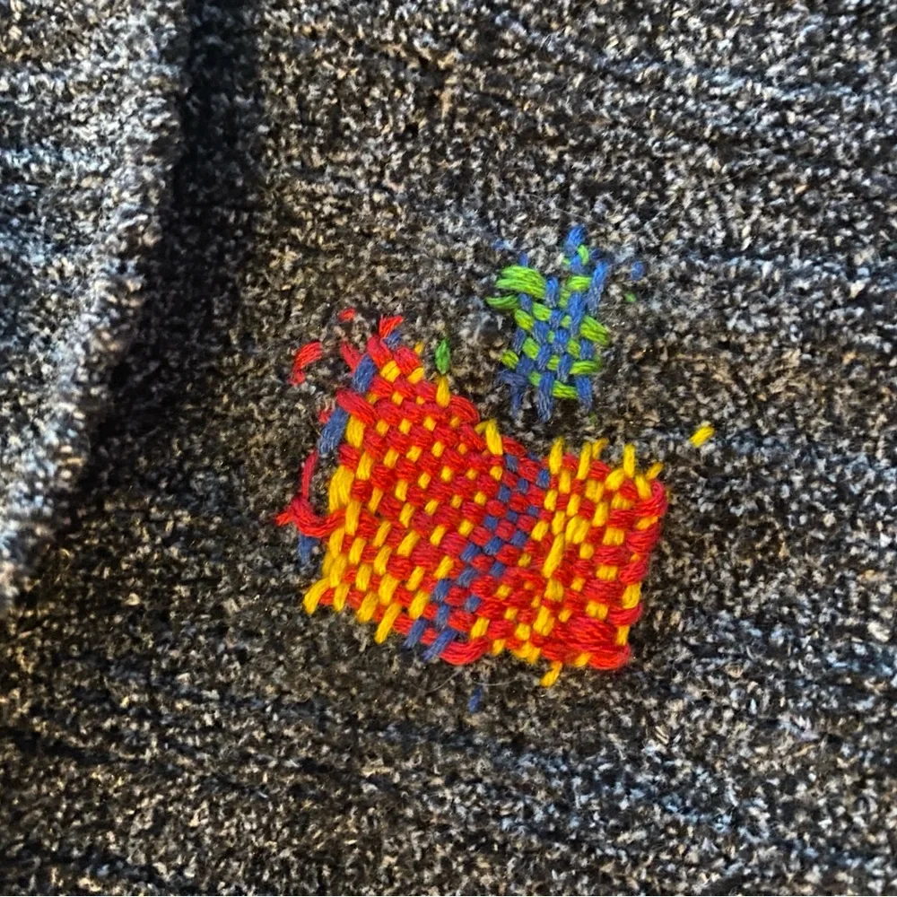 Super Soft Distressed Turtle Neck Sweater with Colorful Repairs.